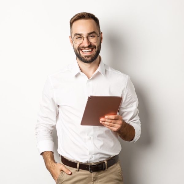 confident-business-man-holding-digital-tablet-and-smiling-standing